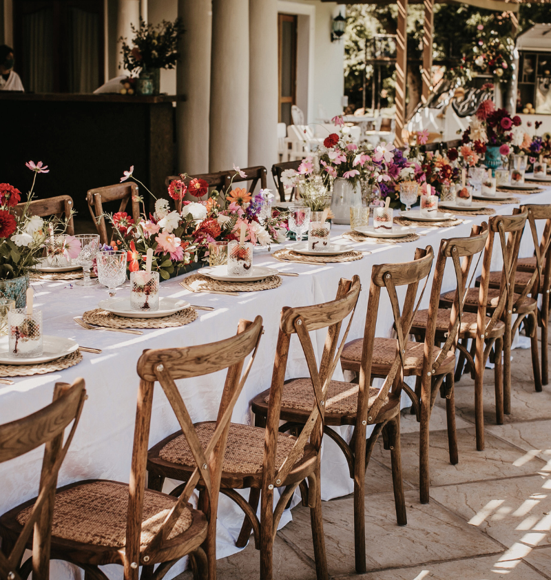 Long outdoor wedding table with flowers